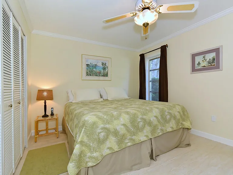 2nd bedroom with king bed and 65'' TV