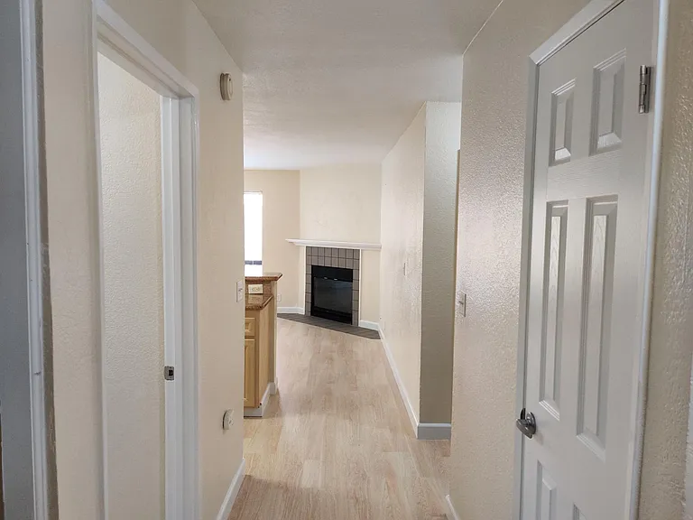 Pantry(right), walkway to kitchen / living (straight), door for master bed / bath (left)