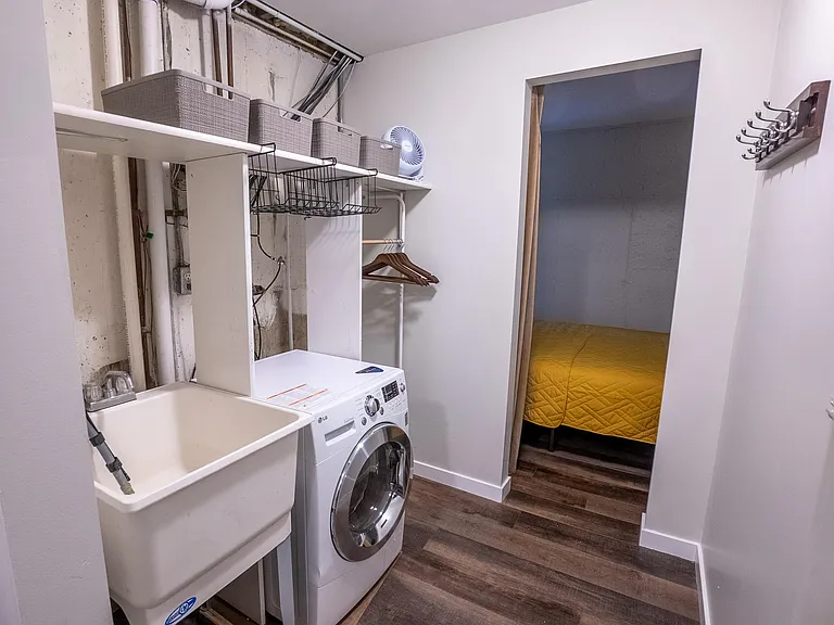 Washer, dryer combo in closet area.