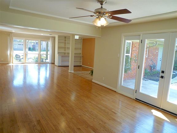 Floor-to-ceiling windows in living room. French doors in den. Double paned windows throughout.