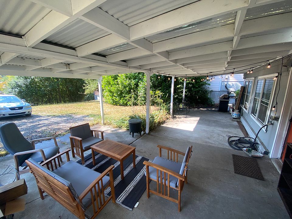 Private entrance with covered carport and patio