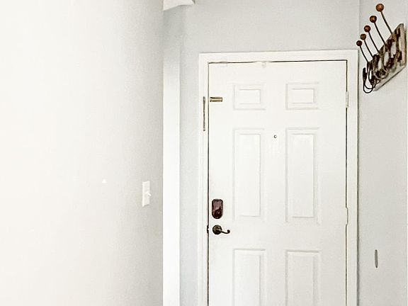 Entry Hallway. Bedroom #1 to the left. Great for teenager, craft room or office!