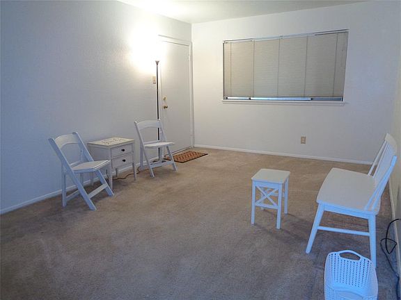 Freshly painted spacious living room;all of condo repainted