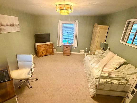 Ground floor bedroom. Closest to kitchen & next to half bath. Full bathroom around the corner.