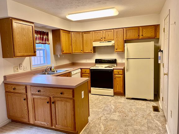 Kitchen with new floor, door on Right goes to downstairs 1/2 bath
