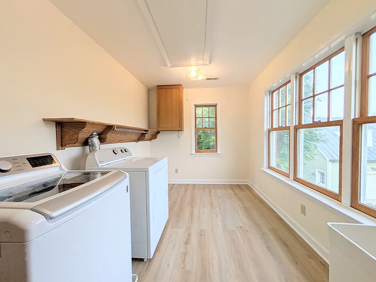 The laundry room is upstairs and is massive! Out the windows you have beautiful mountain views. LVP flooring was added this summer.