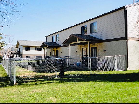 Units have fenced backyard.