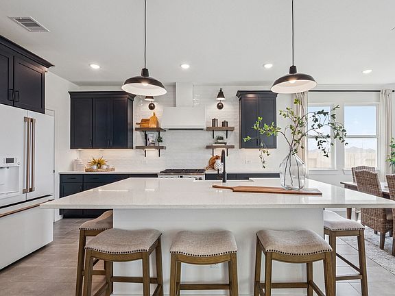 Kitchen with spacious central island pendant lighting