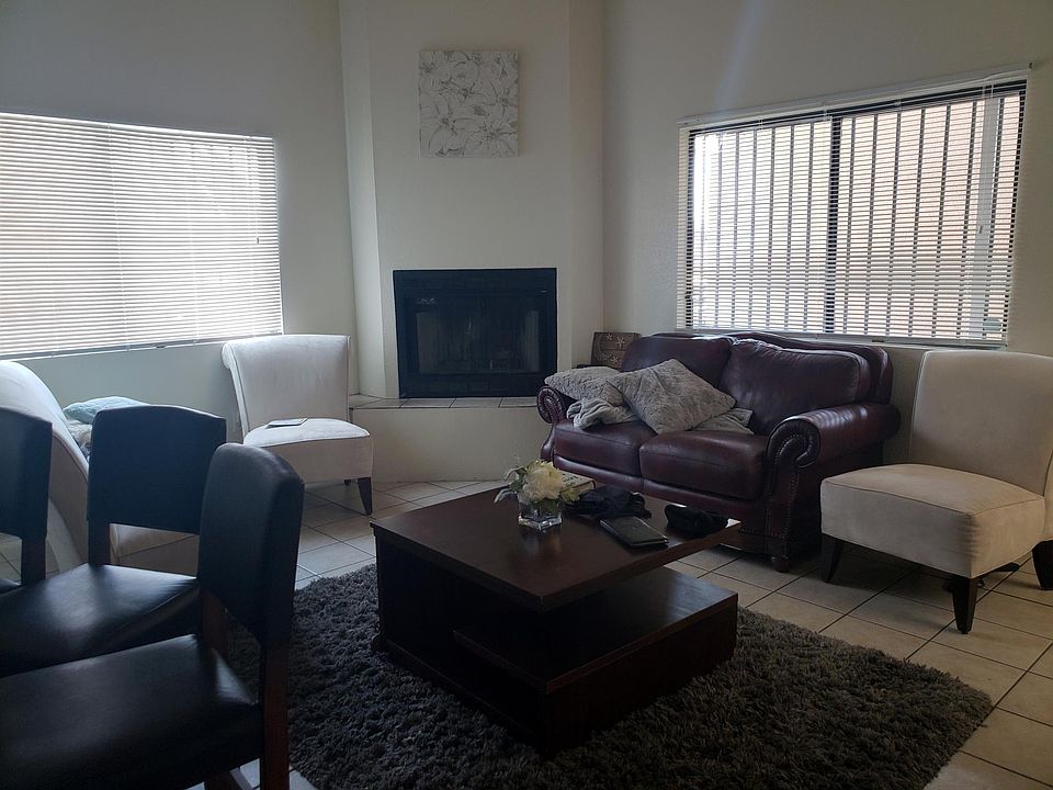 Wood burning fireplace and tall ceilings for a bright open living space.