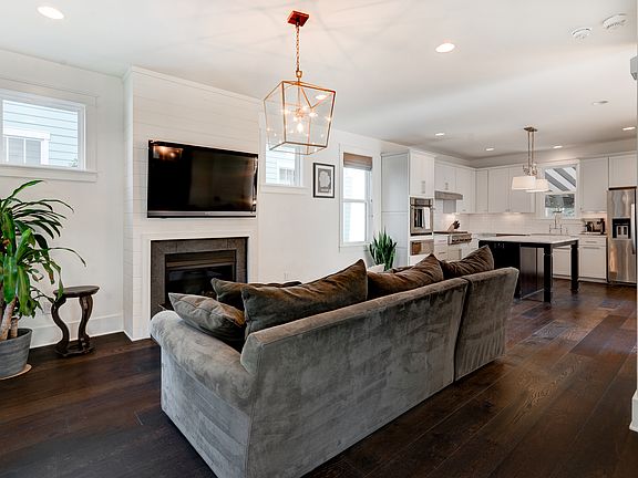 Walk in the front door and this is your view: a wide open first floor with large living space and incredible kitchen. Ample storage on each floor.