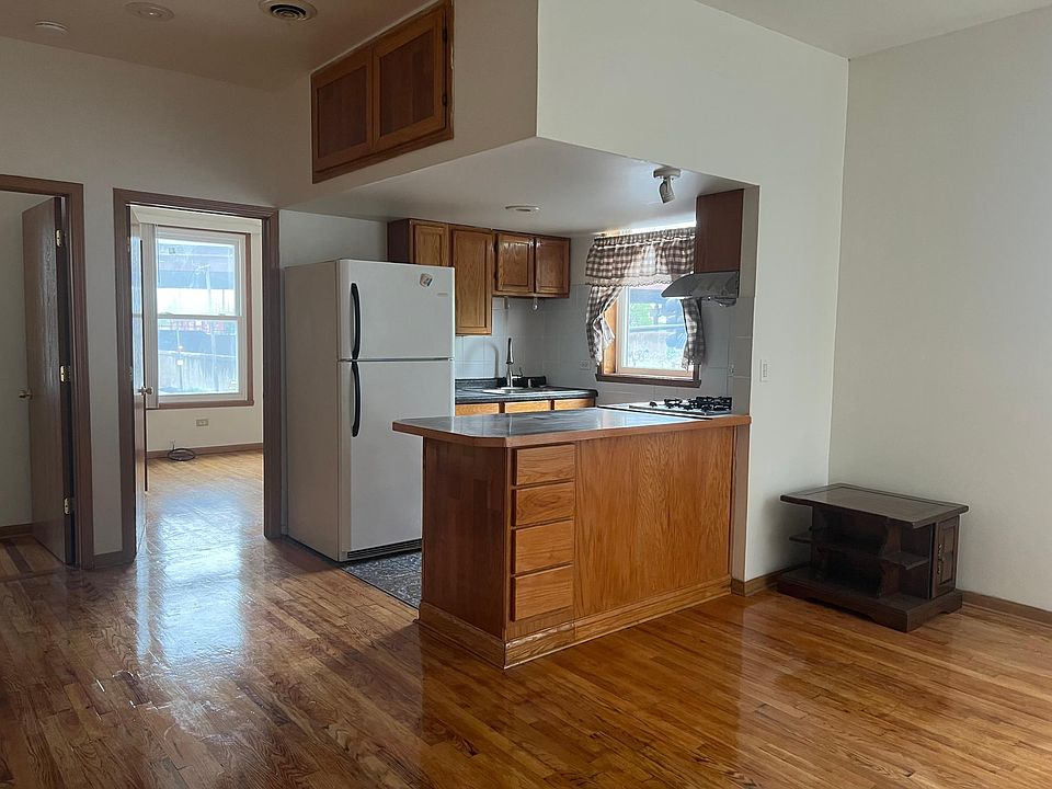 Sizeable overhead storage compartment. Drawers on both sides of the kitchen peninsula counter.