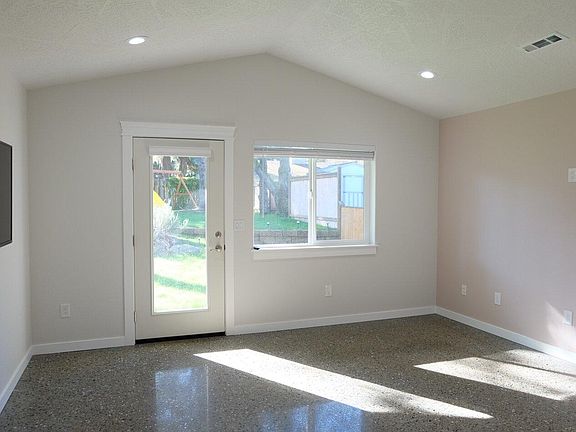 The master bedroom looks out onto the backyard.