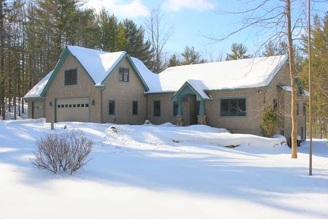 2.64+/- acres nestled in the woods next to the VASA Ski Trail System