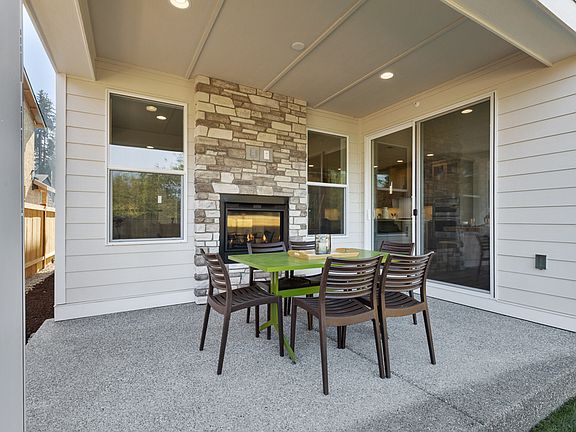 Covered outdoor living with indoor outdoor fireplace
