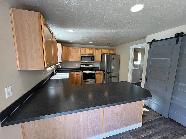 8642 NE Barberry Dr — Photo 7