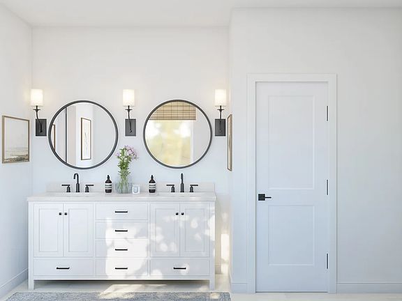 Primary bath features freestanding vanity with dual sinks