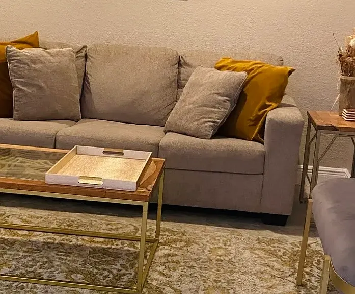 Living room features sofa, coffee table, side tables and guest chairs