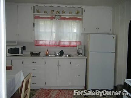 kitchen sink/fridge area