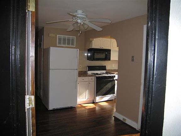 view of dining area and kitchen from back door