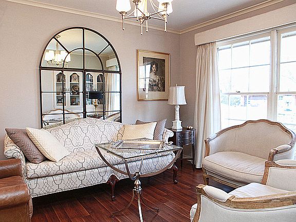 The intimate living room is set up in the smaller room that could also be used as a formal dining area.