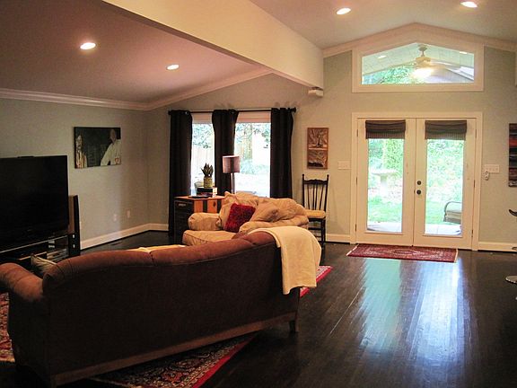 Great room has hardwood, vaulted ceiling, open floor plan