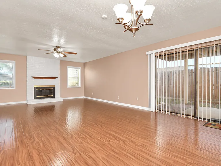 Living room and sliding glass doors to covered patio.