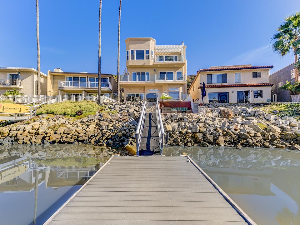 Enjoy exclusive access to your personal boat dock, a serene waterfront patio with lounge chairs and a cozy fire pit, and a spacious private deck. The entire third floor is yours to indulge in ultimate relaxation and breathtaking views.