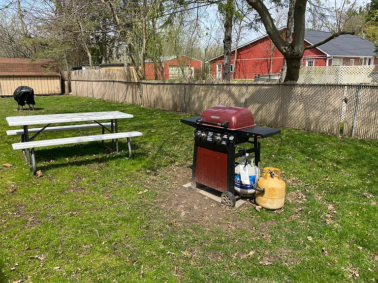Community barbecue and picnic table.