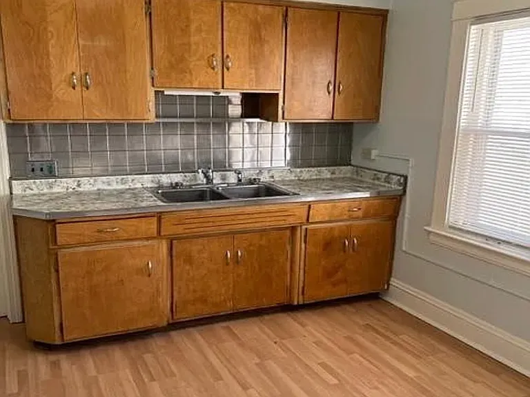 Kitchen cabinets and plenty of room for a dinner table