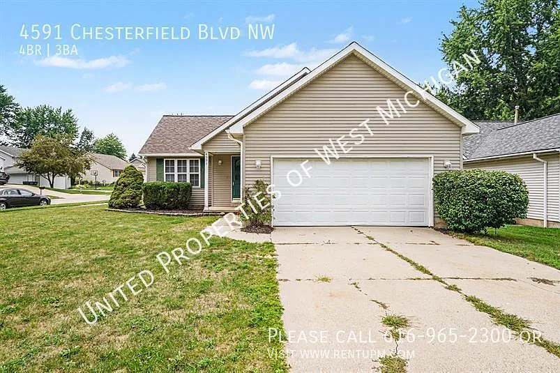 Available Now | 4 Bed 3 Bath Single Family Home in Walker | 2 Stall Garage | Back Patio | Lower L... — Photo 2