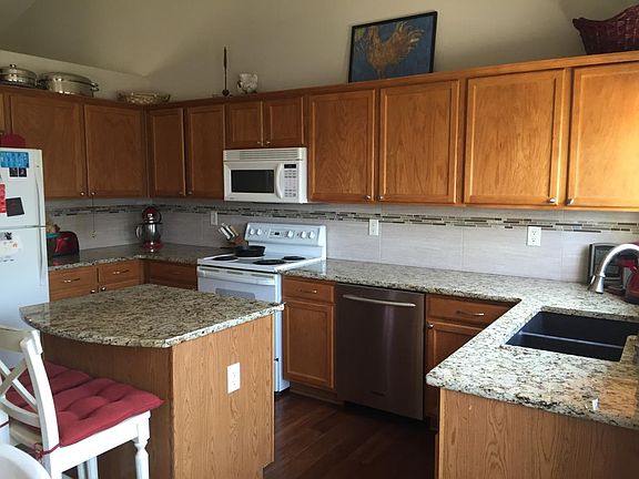 Granite kitchen- new glass cooktop and refrigerator since this picture