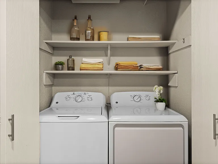 Experience convenience with this chic laundry alcove, designed for efficiency and style.