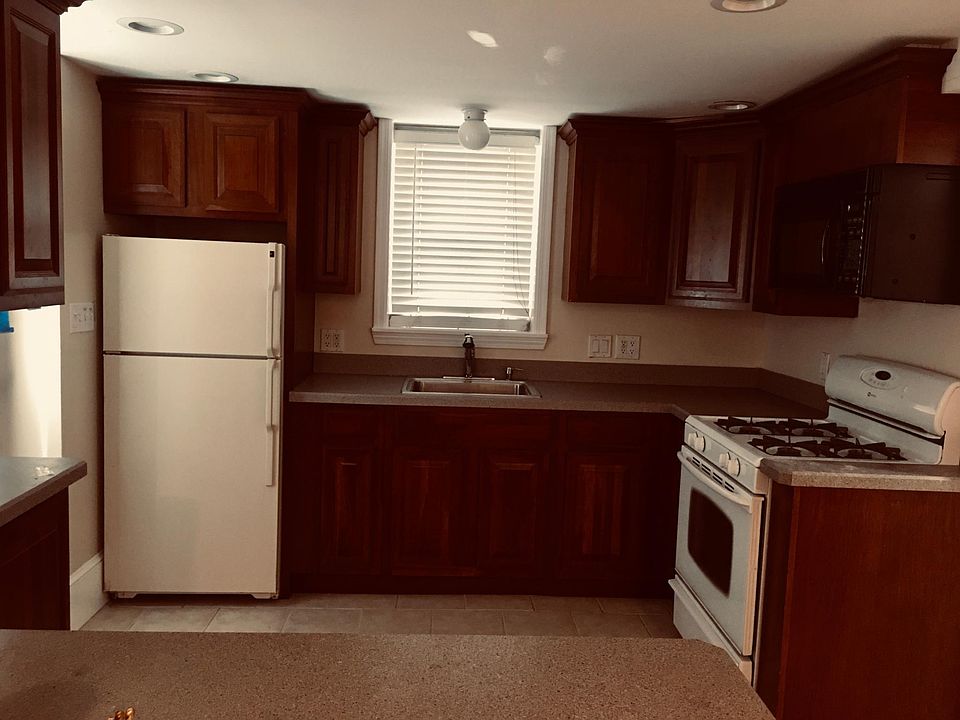 West Wall = Kitchen with Gas Stove. There is a closet to the right of this and the bathroom is to the right of the closet.