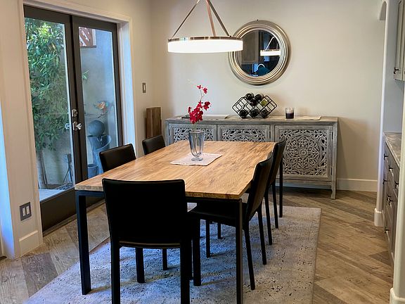 gorgeous spruceberry table and sideboard full of puzzles, games, and space for extra stuff.