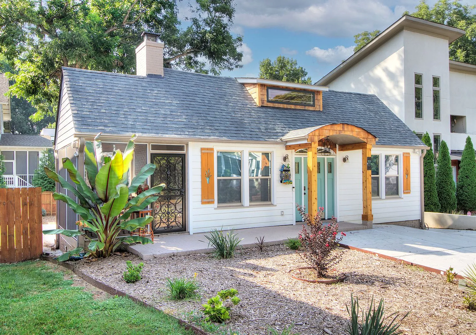 Discover the charm of this top-floor unit in a beautifully updated single-family bungalow — Photo 2