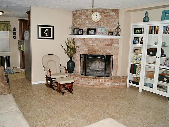LEFT SIDE OF DEN WITH CORNER FIREPLACE