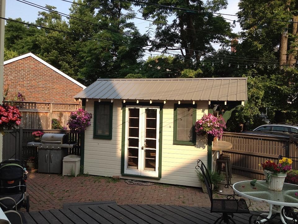 Back Yard Garden Shed with hardwood floors and a bar