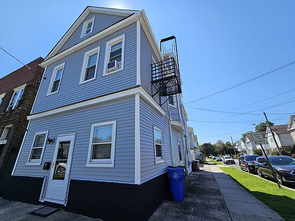 Front entrance and side view of the house.