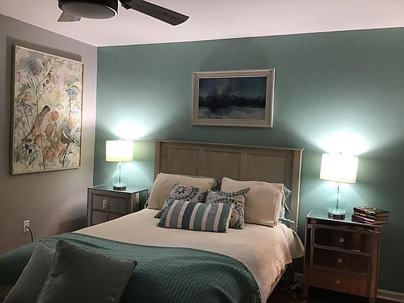 Large bedroom with closet leading to bath.