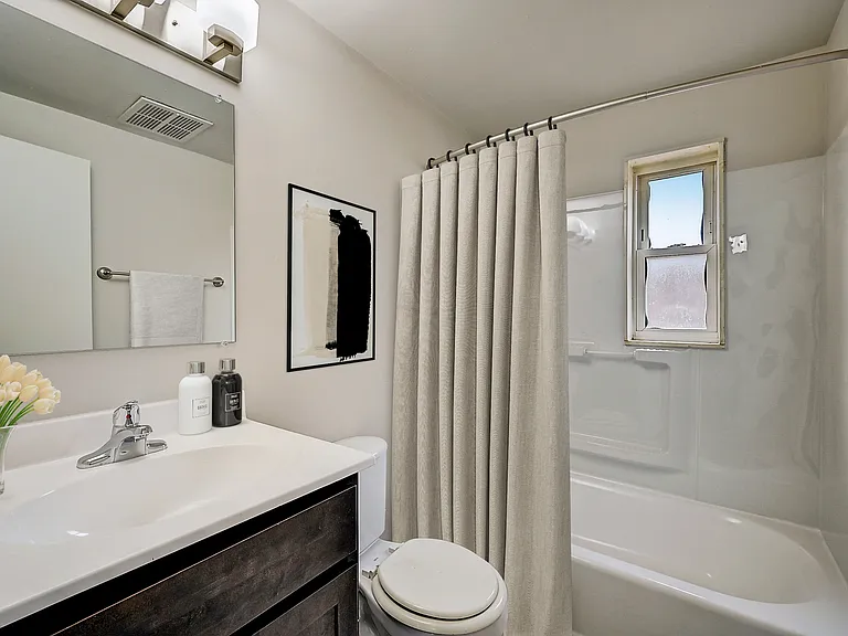 3 BR 1 BA Recently Renovated Townhouse Style Apartments featuring New gray carpet, Neutral paint scheme, Premium hardwood-style flooring, Neutral paint scheme, Upgraded light fixtures, New cabinets, Matching stainless steel appliances, Washer/Dryer, Air c