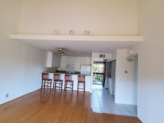 Living and dining room with high volume ceiling