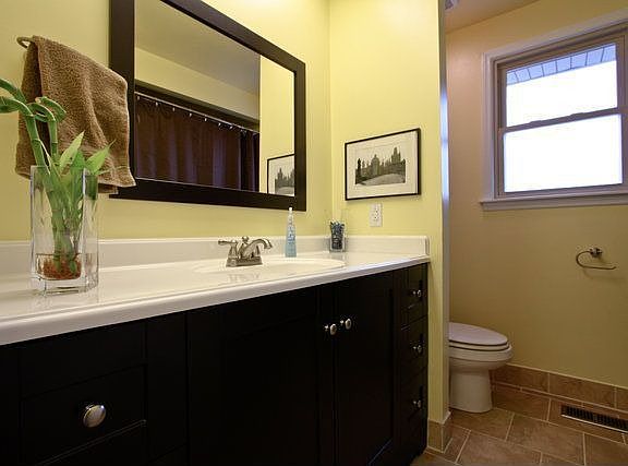 Hall bath with new tile, vanity & tub