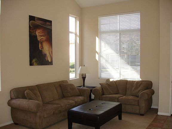 Living & dining room with vaulted ceilings, recessed lighting and custom paint
