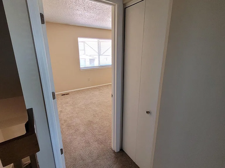 Top of stairs looking into master bedroom