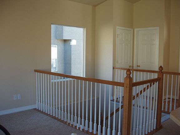 Apx 6 steps to landing, then additional 6 steps to Lower Level.
Door on left is Coat Closet; door on right is Powder Room.