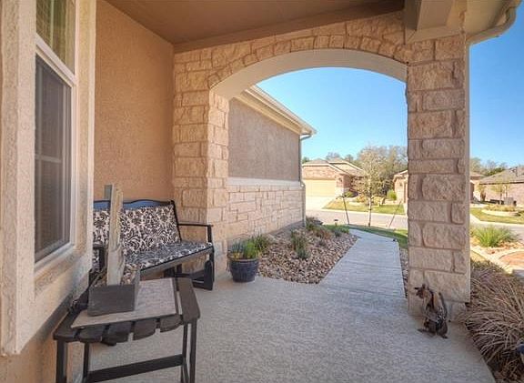 A fun Front Sitting Porch welcomes your gus4ets at this wonderful Sun City Texas Gray Myst.