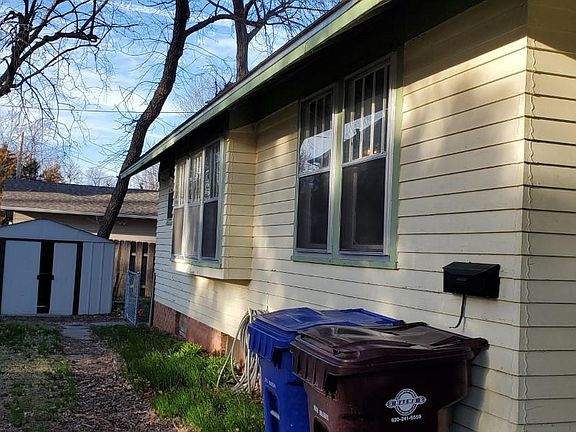 Westside of home with storage shed.