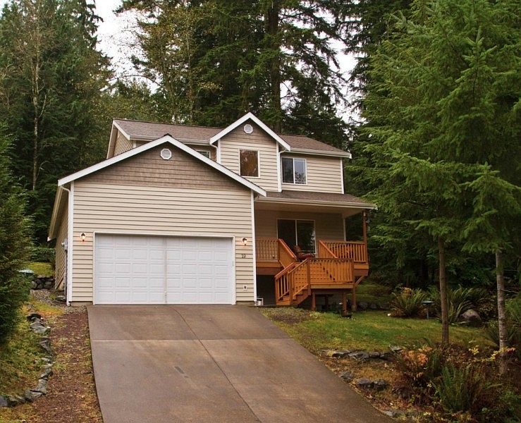 The privacy and tranquilty of this home are protected by a designated green space in back.