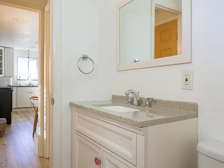 Private half bath off the kitchen
