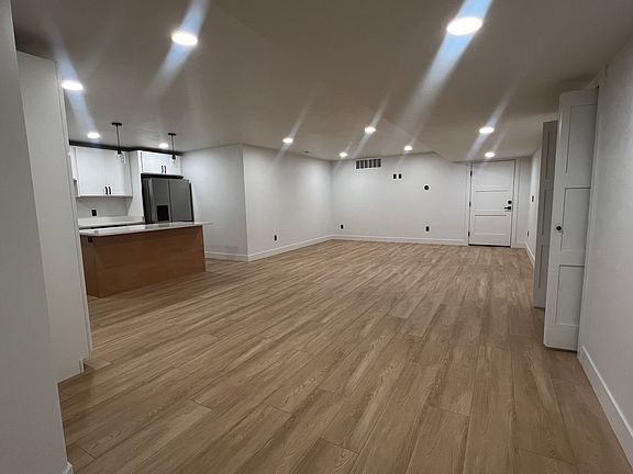 The spacious kitchen comes equipped with brand-new, top-of-the-line appliances, including an LG refrigerator, LG microwave, LG dishwasher, and a 36-inch Cosmo convection oven, ideal for culinary enthusiasts.